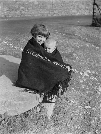 PORTRAIT OF LITTLE GIRL WITH BABY